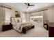 Cozy bedroom with a large window and soft carpet flooring with stylish furnishing and decorations at 26999 W Ponderosa Ln, Buckeye, AZ 85396