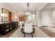 Elegant dining room featuring a modern chandelier, stylish buffet, and neutral decor at 26999 W Ponderosa Ln, Buckeye, AZ 85396