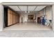 Well-organized garage with custom cabinets, providing ample storage and workspace at 26999 W Ponderosa Ln, Buckeye, AZ 85396