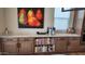 Stylish kitchen boasts custom cabinets, granite countertops and high end coffee maker at 26999 W Ponderosa Ln, Buckeye, AZ 85396