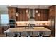 Contemporary kitchen featuring an island with seating and stainless steel appliances at 26999 W Ponderosa Ln, Buckeye, AZ 85396