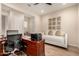 Comfortable home office with a sofa and large work space; bright with great lighting at 26999 W Ponderosa Ln, Buckeye, AZ 85396