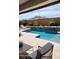 Back yard pool with water feature and mountain view at 26999 W Ponderosa Ln, Buckeye, AZ 85396