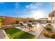 Well-maintained backyard pool area with patio seating, a grill, and landscaping at 26999 W Ponderosa Ln, Buckeye, AZ 85396