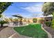 Spacious backyard featuring a pool, turf, and lounge chairs at 2896 E Maplewood St, Gilbert, AZ 85297