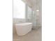 Modern bathroom showcasing a freestanding tub and glass-enclosed shower for a spa-like experience at 2896 E Maplewood St, Gilbert, AZ 85297