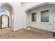 Private courtyard with a decorative metal gate and views of the outdoor space and the home's exterior at 2896 E Maplewood St, Gilbert, AZ 85297