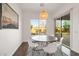 Charming dining area with pool views and a stylish light fixture, perfect for casual meals at 2896 E Maplewood St, Gilbert, AZ 85297