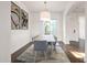 Formal dining room featuring hardwood floors, modern lighting, and a neutral color scheme at 2896 E Maplewood St, Gilbert, AZ 85297