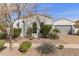 Charming single-Gathering home featuring manicured landscaping, a tile roof, and an attached two-car garage at 2896 E Maplewood St, Gilbert, AZ 85297