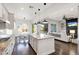 Bright kitchen with granite counters, modern appliances, and open layout leading to the living area at 2896 E Maplewood St, Gilbert, AZ 85297