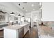 Well-lit kitchen with granite countertops, stainless steel appliances, and views of adjacent living spaces at 2896 E Maplewood St, Gilbert, AZ 85297