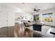 Open-concept living room with stylish furniture and seamless transition to the kitchen and outdoor views at 2896 E Maplewood St, Gilbert, AZ 85297