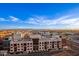 Panoramic aerial view of buildings, rooftop pools, mountain views, and blue sky at 310 S 4Th St # 901, Phoenix, AZ 85004