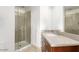 Well-lit bathroom featuring a glass shower and a vanity with a modern sink at 310 S 4Th St # 901, Phoenix, AZ 85004