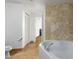 Relaxing bathroom with soaking tub, neutral tile and walk-in closet at 310 S 4Th St # 901, Phoenix, AZ 85004