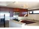Modern kitchen with stainless steel appliances, dark cabinets and granite counter tops at 310 S 4Th St # 901, Phoenix, AZ 85004