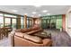 Elegant lounge featuring a large leather couch, coffee table, and floor-to-ceiling windows with a view at 310 S 4Th St # 901, Phoenix, AZ 85004