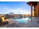 Rooftop pool featuring clear water, comfortable seating, and expansive city views at 310 S 4Th St # 901, Phoenix, AZ 85004