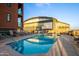 Relaxing rooftop pool area with comfortable lounge chairs and a view of the baseball stadium at 310 S 4Th St # 901, Phoenix, AZ 85004