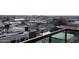 A rooftop view overlooking city buildings, palm trees, and tennis courts from a high vantage point at 310 S 4Th St # 901, Phoenix, AZ 85004