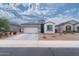 Charming single-story home featuring a two-car garage and low-maintenance desert landscaping at 31045 W Mulberry Dr, Buckeye, AZ 85396