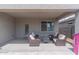 Relaxing covered patio with comfortable seating, perfect for outdoor entertaining and enjoying the backyard at 31045 W Mulberry Dr, Buckeye, AZ 85396