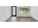 Neutral bedroom featuring hard wood floors, a closet, and a window providing natural light at 3330 E Palm Ln, Phoenix, AZ 85008