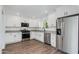 Modern kitchen featuring white cabinets, stainless steel appliances, and granite countertops at 3330 E Palm Ln, Phoenix, AZ 85008