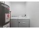 Functional laundry room featuring a washing machine, dryer, and water heater at 3330 E Palm Ln, Phoenix, AZ 85008