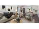 Bright living area showcasing modern décor, stylish furnishings, and a seamless flow to the dining space at 3330 E Palm Ln, Phoenix, AZ 85008