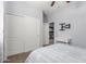 Bedroom features an open door to the bathroom, tv mount, and sliding closet doors at 37161 W Giallo Ln, Maricopa, AZ 85138
