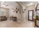 Welcoming entryway with decorative wall art and tile flooring at 37161 W Giallo Ln, Maricopa, AZ 85138