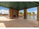 Community gazebo overlooks the pond at 37161 W Giallo Ln, Maricopa, AZ 85138