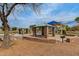Community playground featuring multiple picnic tables, and a covered play structure at 37161 W Giallo Ln, Maricopa, AZ 85138