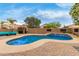Sparkling pool features sleek tilework, and a seamless transition from the patio to the pool at 37161 W Giallo Ln, Maricopa, AZ 85138