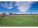 Well-maintained tennis court providing residents with a great recreational amenity to enjoy in the community at 37161 W Giallo Ln, Maricopa, AZ 85138