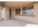 Covered patio with concrete floors and large windows at 39960 W Bunker Dr, Maricopa, AZ 85138