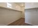 Walk-in closet with shelving and rod for ample storage at 39960 W Bunker Dr, Maricopa, AZ 85138