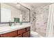 Bathroom features a tile shower, modern fixtures, and stylish design at 4138 W Barbara Ave, Phoenix, AZ 85051