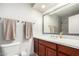 Bathroom with vanity, mirror, and towel rack at 4138 W Barbara Ave, Phoenix, AZ 85051