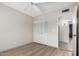 Bedroom with closet, wood-look floors, and neutral paint colors at 4138 W Barbara Ave, Phoenix, AZ 85051