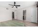 Bedroom boasts a ceiling fan and natural light from the window at 4138 W Barbara Ave, Phoenix, AZ 85051