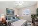 Comfortable bedroom features bright natural light and calming colors at 4138 W Barbara Ave, Phoenix, AZ 85051