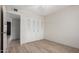 Bedroom with closet, wood-look floors, and neutral paint colors at 4138 W Barbara Ave, Phoenix, AZ 85051