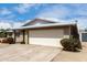 Charming single-story home with a two-car garage, neutral brick facade, and a well-maintained driveway at 4138 W Barbara Ave, Phoenix, AZ 85051