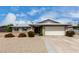 Charming single-story brick home featuring a well-manicured front yard and attached two-car garage at 4138 W Barbara Ave, Phoenix, AZ 85051