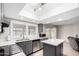Bright kitchen features stainless appliances, gray cabinetry and an island at 4138 W Barbara Ave, Phoenix, AZ 85051