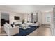 Bright living room featuring modern furnishings, tile flooring, and ample natural light at 4138 W Barbara Ave, Phoenix, AZ 85051
