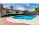 Pool area with brick accents and lush greenery at 4138 W Barbara Ave, Phoenix, AZ 85051